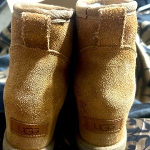 Wheat/tan Ugg wedge boots.